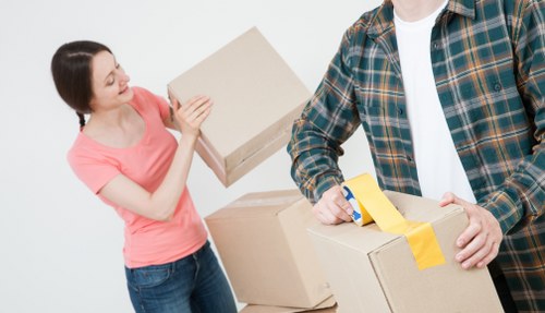 Workers loading items safely into a moving van