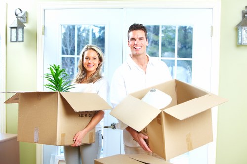 Professional man and van crew handling belongings with care