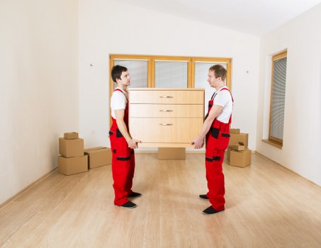 Staff wearing PPE during a safe moving operation